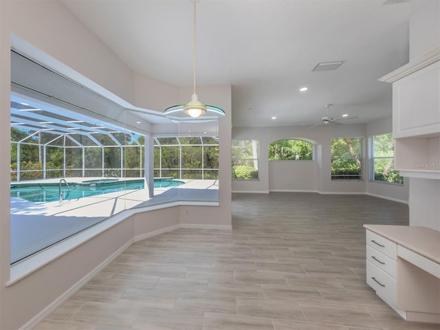 view of pool featuring ceiling fan