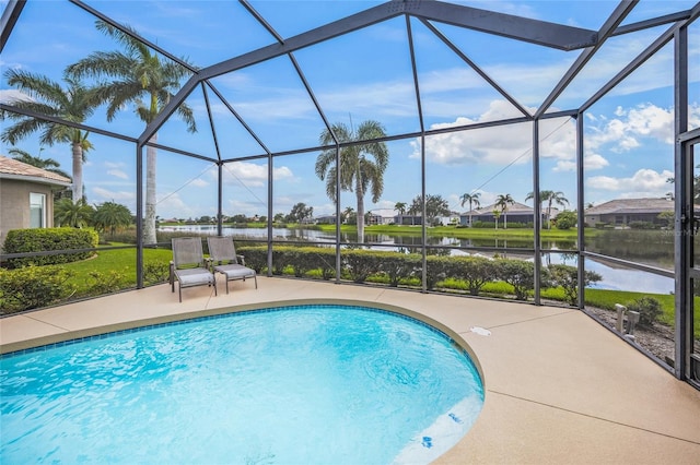 view of swimming pool featuring a lanai, a patio, and a water view