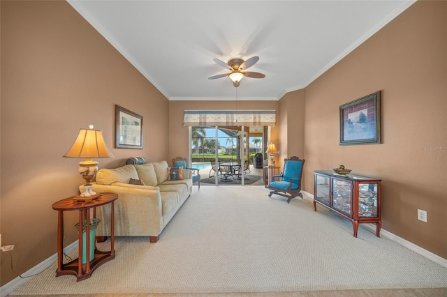 carpeted living room with ornamental molding and ceiling fan