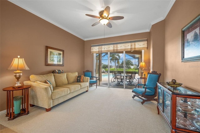 living room with carpet floors, crown molding, and ceiling fan