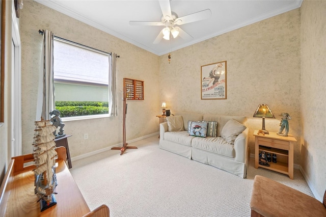 carpeted living room with ornamental molding and ceiling fan