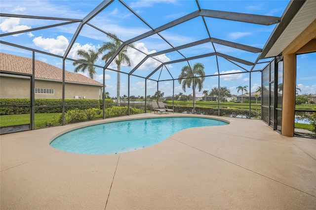 view of swimming pool with a lanai and a patio area