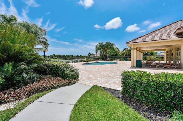 view of swimming pool with a patio area