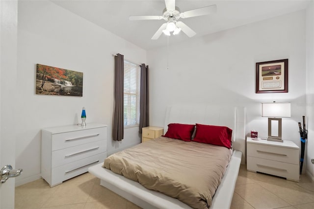 bedroom with ceiling fan and light tile patterned flooring