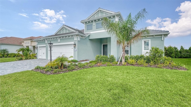 view of front of home featuring a front yard and a garage