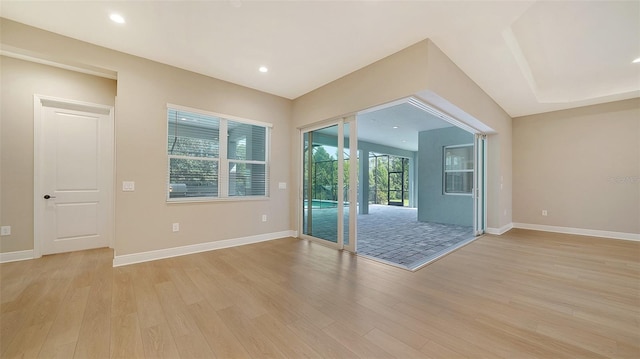 unfurnished room with light wood-type flooring