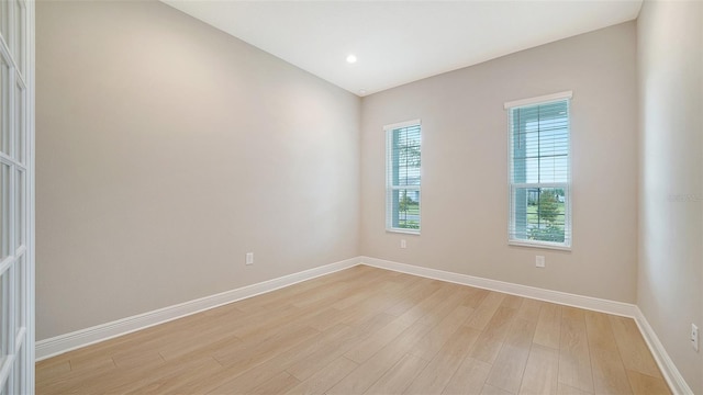 spare room with light wood-type flooring