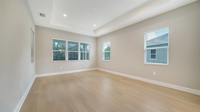 empty room with light hardwood / wood-style flooring