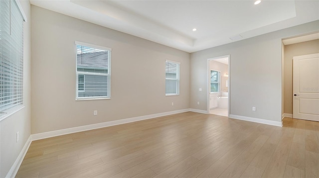 spare room with light hardwood / wood-style flooring