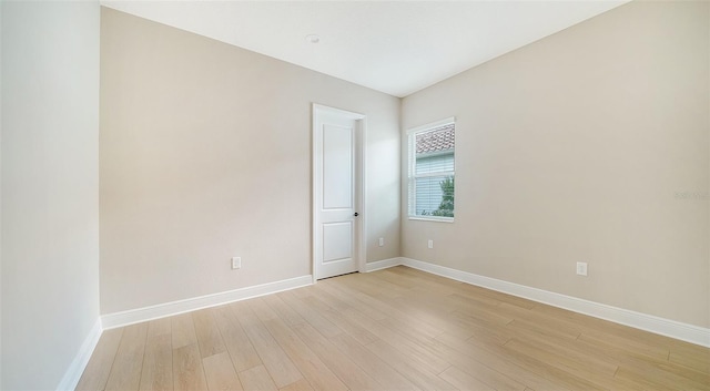 unfurnished room with light hardwood / wood-style floors