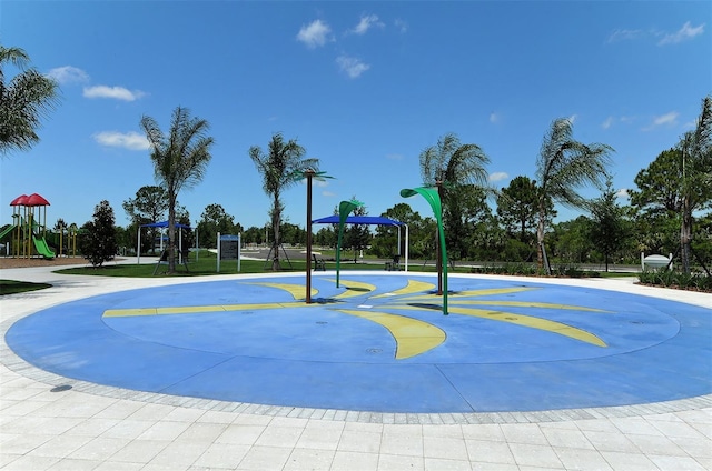 view of sport court featuring a playground