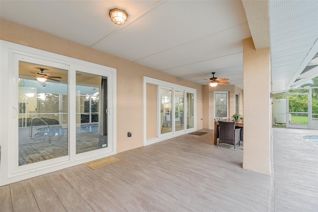 exterior space with ceiling fan and a wooden deck