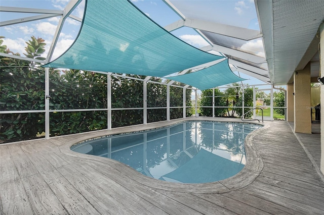 view of swimming pool with a lanai