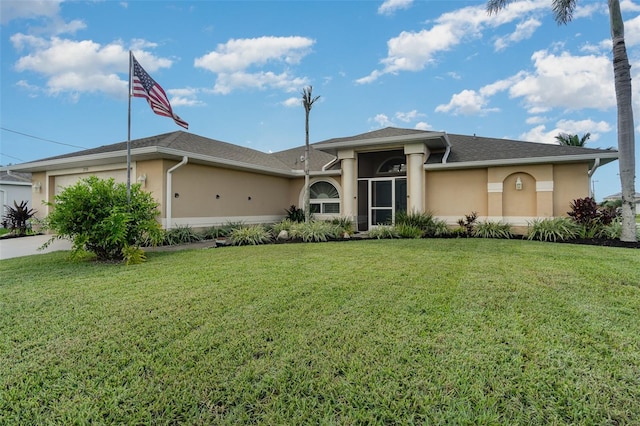 view of front of home with a garage and a front yard