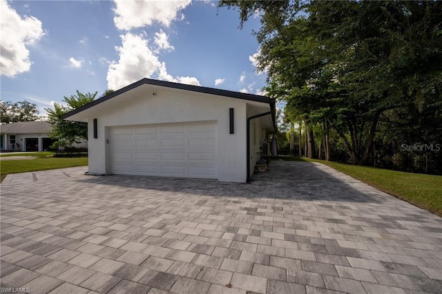 garage featuring a yard