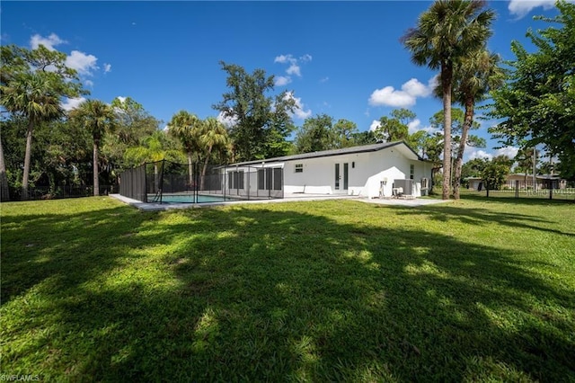 view of yard featuring a patio and a fenced in pool