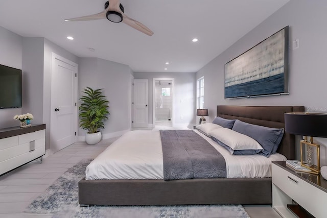 bedroom with ceiling fan and light hardwood / wood-style flooring