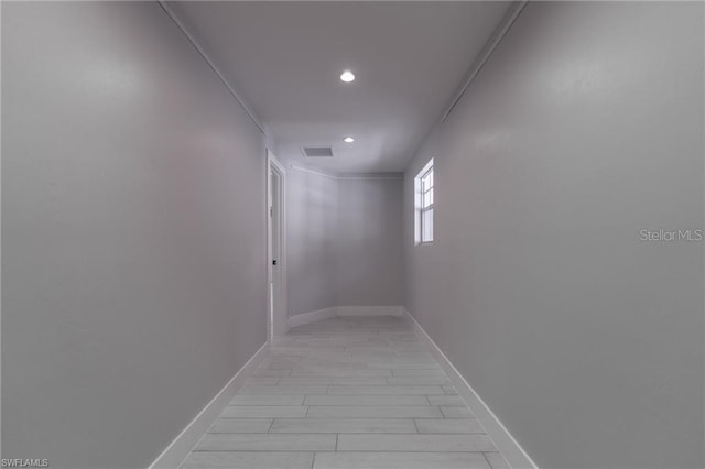 hallway featuring crown molding