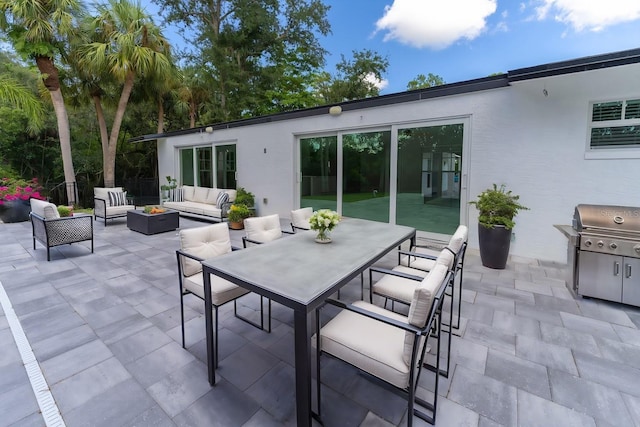 view of patio / terrace featuring an outdoor living space and area for grilling