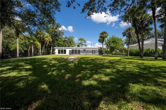 view of yard with a sunroom