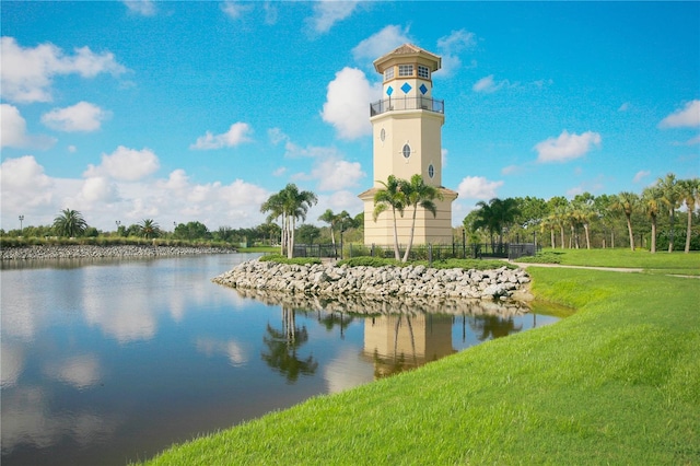 exterior space featuring a water view and a yard