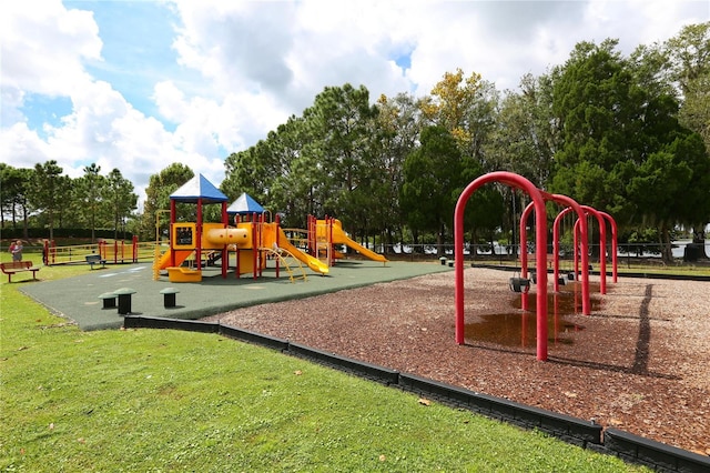 view of jungle gym featuring a lawn