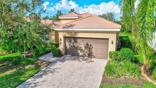 view of front of home with a garage