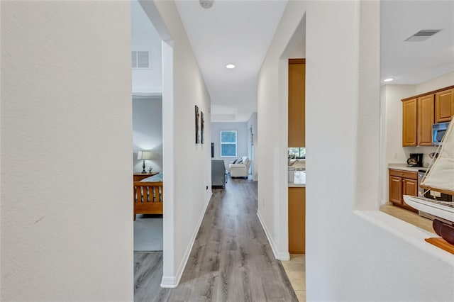 hall featuring light wood-type flooring