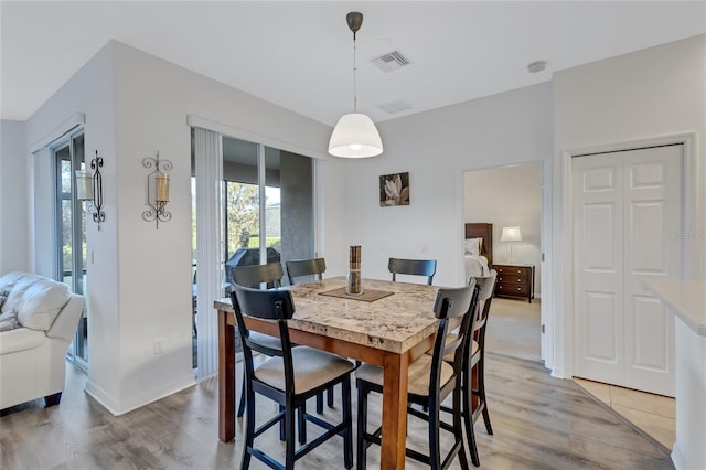 dining area with light wood-type flooring