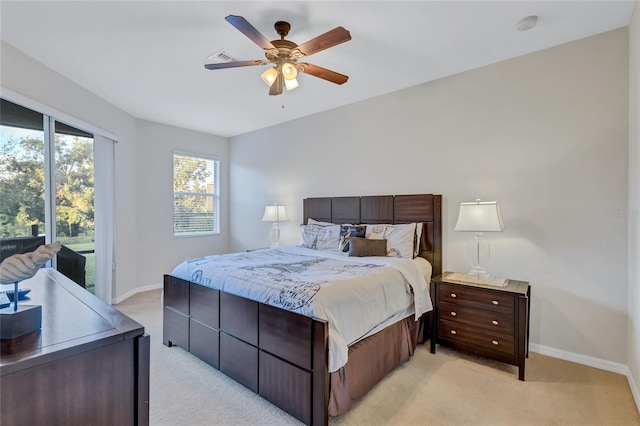 bedroom featuring light carpet and ceiling fan