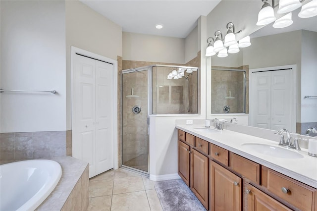 bathroom featuring vanity, tile patterned floors, and separate shower and tub