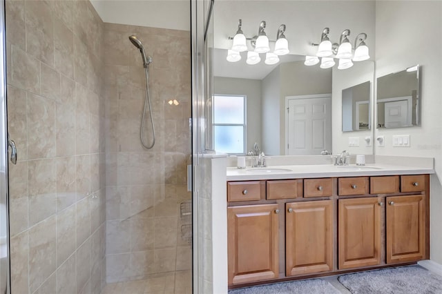 bathroom with vanity and a shower with shower door