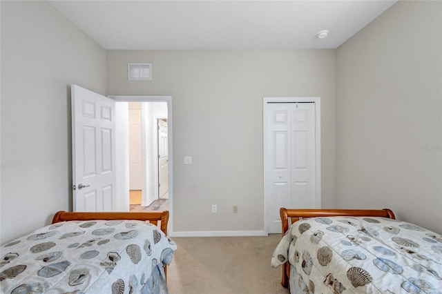 carpeted bedroom with a closet