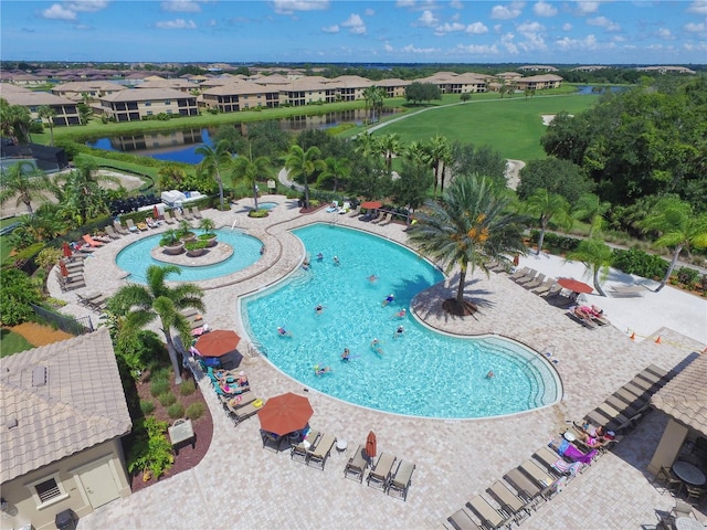 view of pool featuring a water view