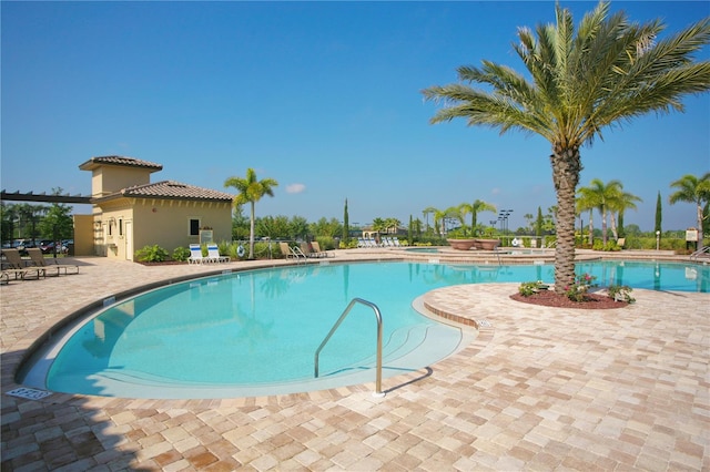 view of swimming pool with a patio area