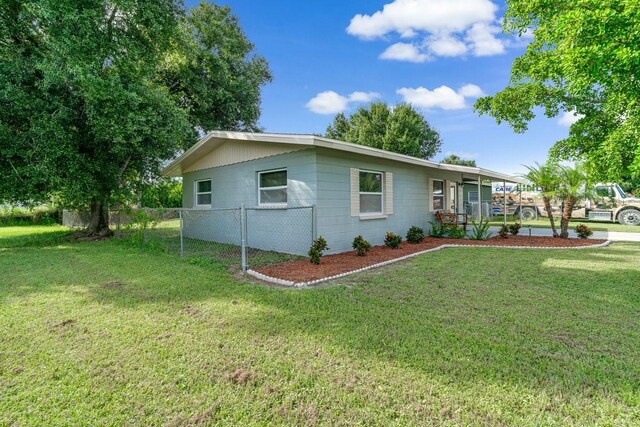 view of property exterior featuring a yard