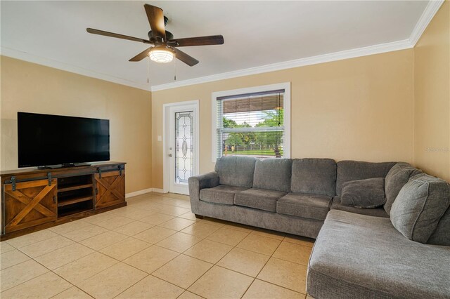 tiled living room with ceiling fan and ornamental molding