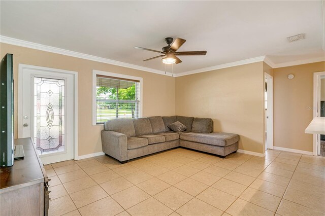 living room with ceiling fan, light tile patterned flooring, and crown molding