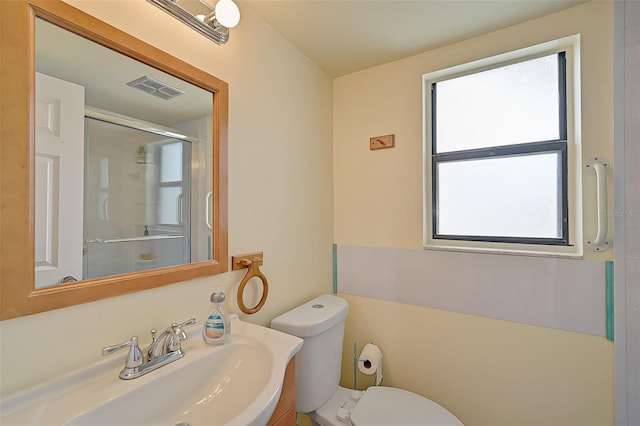 1026 Bird Bay Way Unit 276, Venice, FL 34285 - bathroom with toilet, a shower with shower door, and vanity