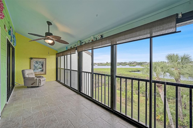 1026 Bird Bay Way Unit 276, Venice, FL 34285 - unfurnished sunroom featuring ceiling fan, vaulted ceiling, and a water view