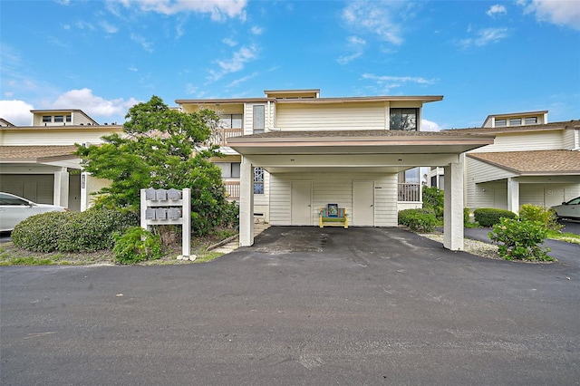1026 Bird Bay Way Unit 276, Venice, FL 34285 - multi unit property featuring a carport and asphalt driveway
