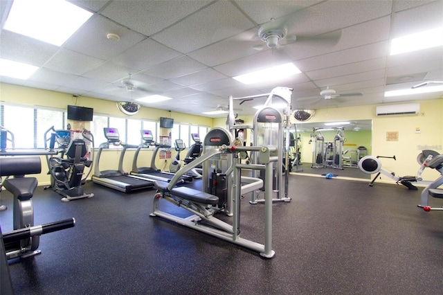 1026 Bird Bay Way Unit 276, Venice, FL 34285 - workout area with ceiling fan, a drop ceiling, an AC wall unit, and healthy amount of natural light
