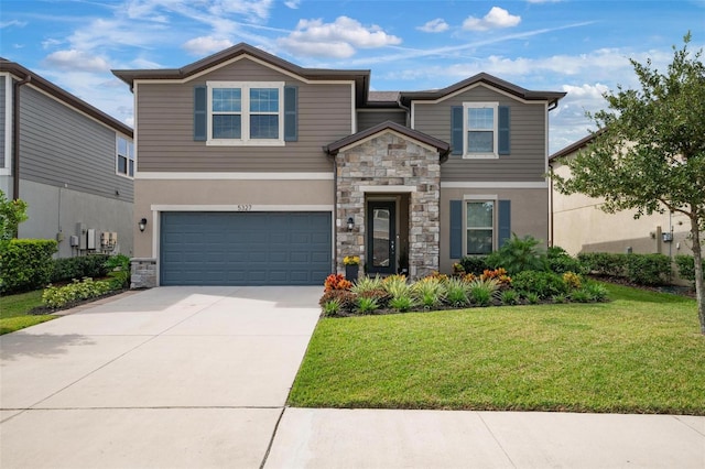 front of property featuring a garage and a front yard