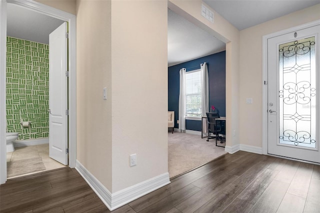 foyer with dark hardwood / wood-style flooring