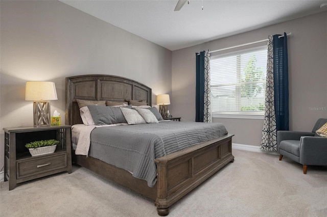 bedroom featuring ceiling fan and light colored carpet