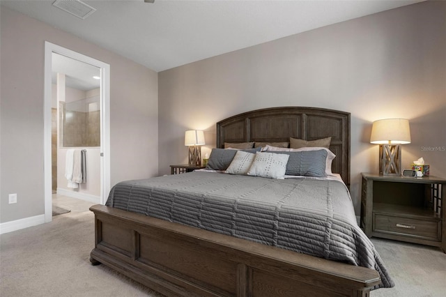 carpeted bedroom featuring connected bathroom