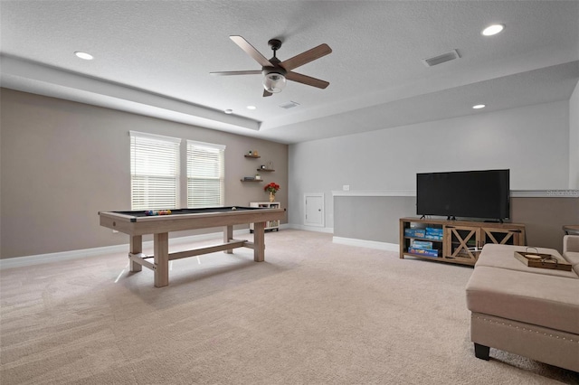 rec room with light carpet, ceiling fan, billiards, and a textured ceiling