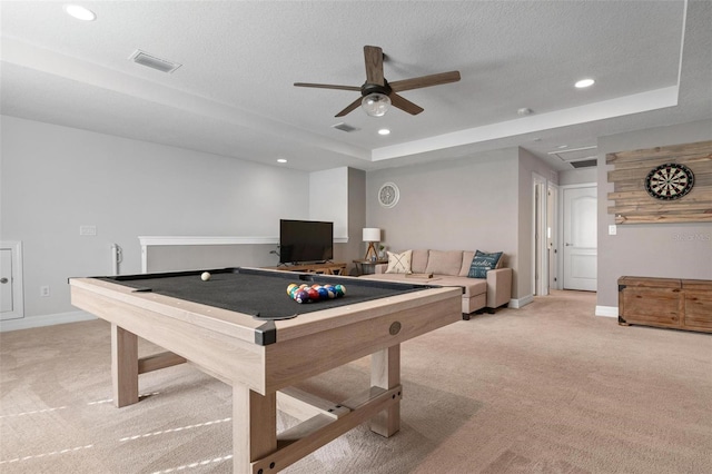 rec room featuring ceiling fan, a textured ceiling, a tray ceiling, light carpet, and billiards