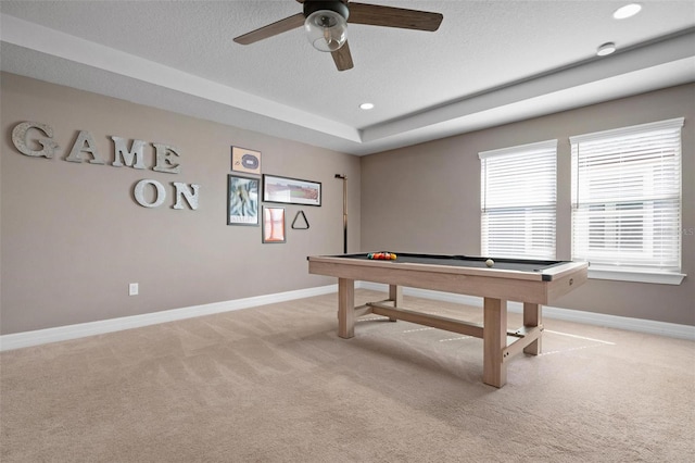 rec room featuring a textured ceiling, light carpet, ceiling fan, and billiards