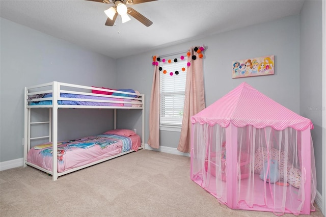 bedroom featuring light carpet and ceiling fan